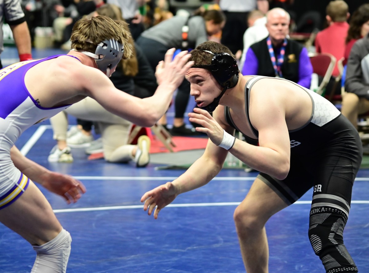 Waverly-Shell Rock's Bas Diaz (right) circles the mat during a 150-pound match during the Class 3A semifinals against Johnston's Caden Leonard at the IHSAA state tournament on Thursday at Wells Fargo Arena in Des Moines.(Photo by Ryan Timmerman)